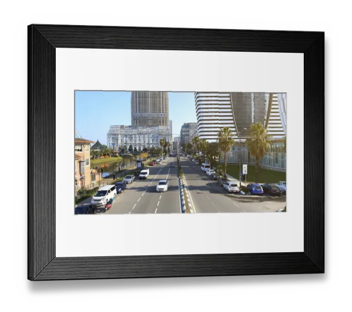 Framed Print : 10.02.2025, Batumi, Georgia: A wide urban boulevard lined with palm trees