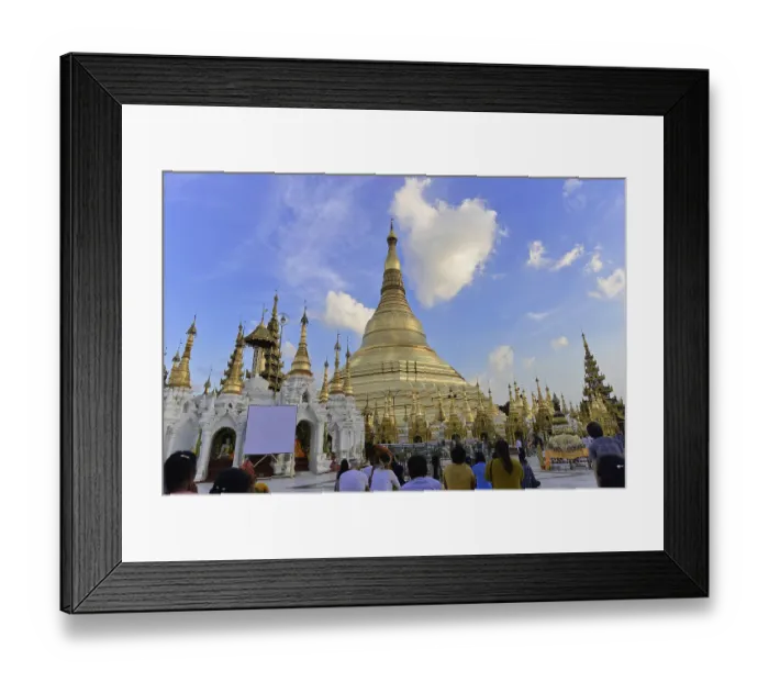 Framed Print : People gather to pray at a famous pagoda under a blue sky