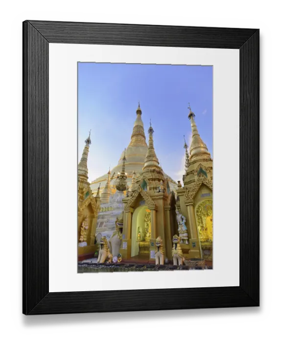 Framed Print : Golden pagoda and towers in evening light against a clear sky