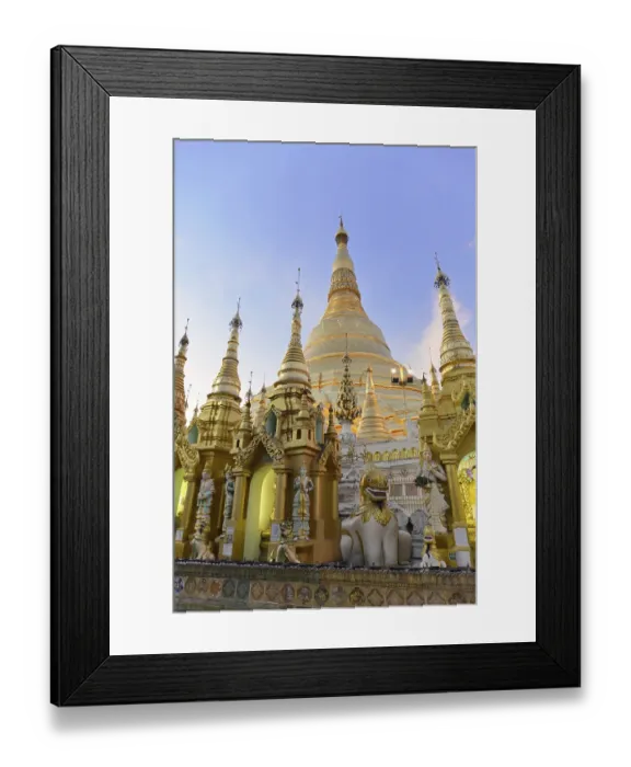 Framed Print : Large golden stupas under a blue sky in an evening mood