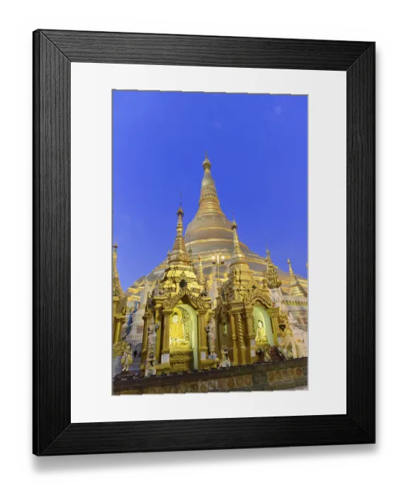 Framed Print : Golden stupas shining in evening light against deep blue sky Framed Print : Golden stupas shining in evening light against deep blue sky