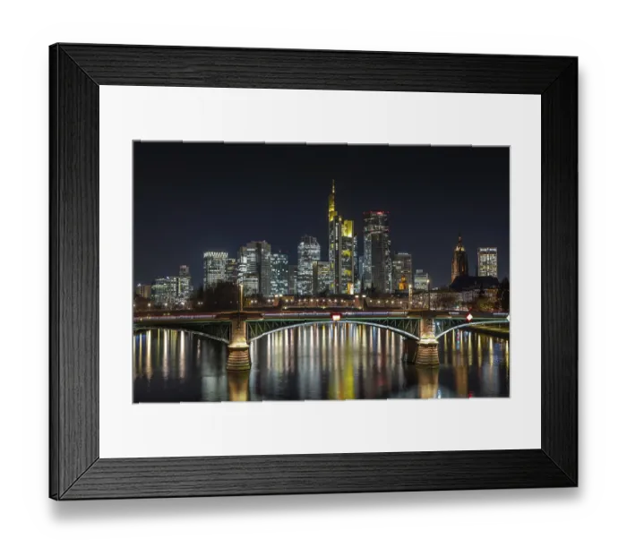 Framed Print : The lights of Frankfurt's banking skyline glow in the evening