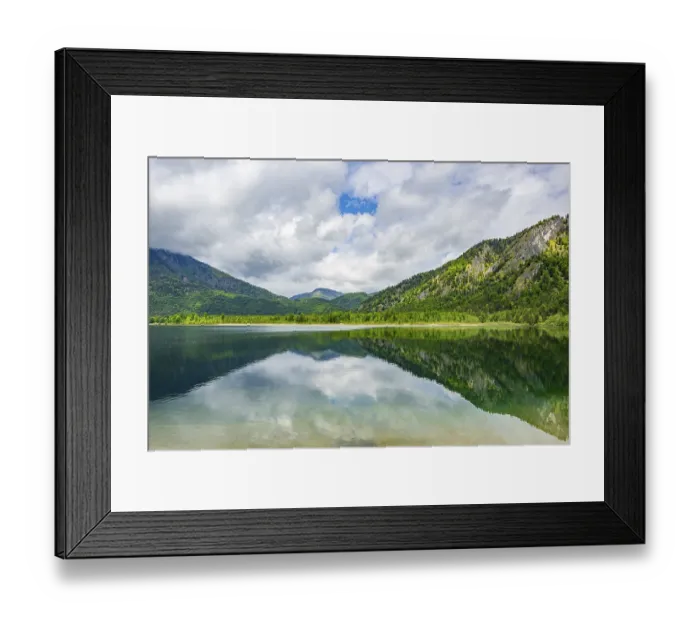 Framed Print : Landscape of Lake Offensee after rain when the sun comes through the clouds in spring