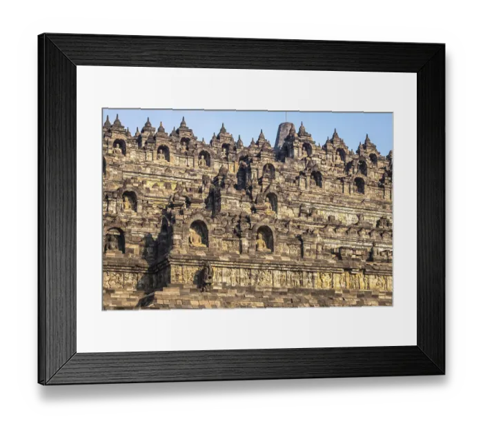 Framed Print : The historic Borobudur temple with its detailed reliefs in Indonesia during daylight Framed Print : The historic Borobudur temple with its detailed reliefs in Indonesia during daylight
