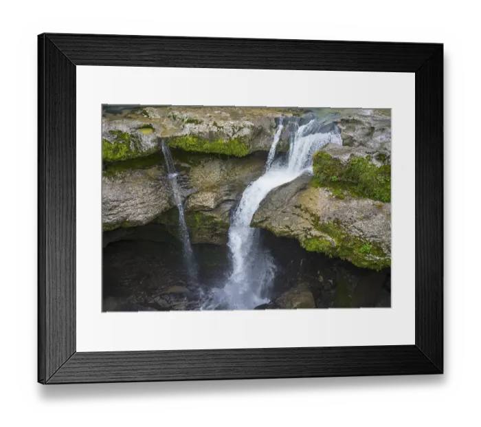 Framed Print : Water falling into a river over moss-covered rocks Framed Print : Water falling into a river over moss-covered rocks