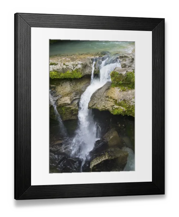 Framed Print : Dynamic waterfall flowing through a rocky gorge