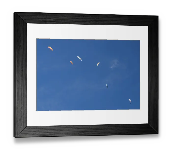 Framed Print : Paragliders in the sky above Brauneck