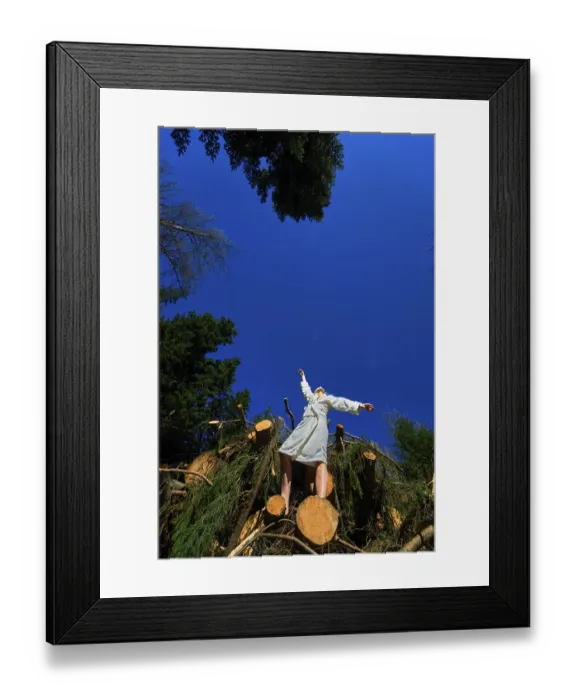 Framed Print : Feeling ease standing on pile of wood in Waakirchen