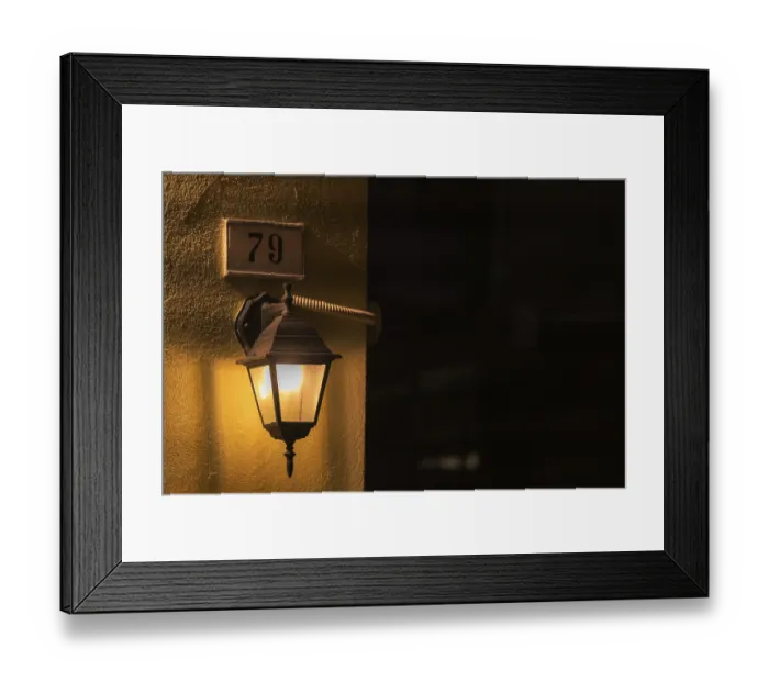 Framed Print : Old vintage style street lamp hanging at the house door fence Framed Print : Old vintage style street lamp hanging at the house door fence