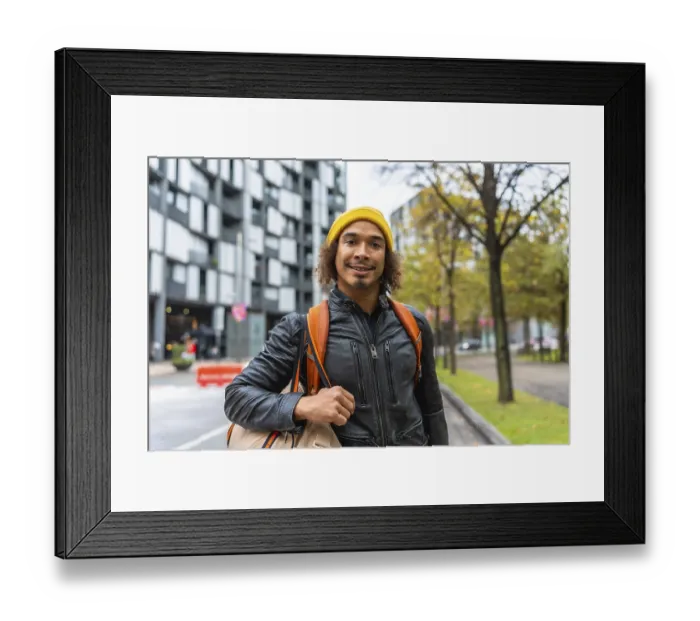 Framed Print : Young man with curly hair in a yellow beanie and leather jacket