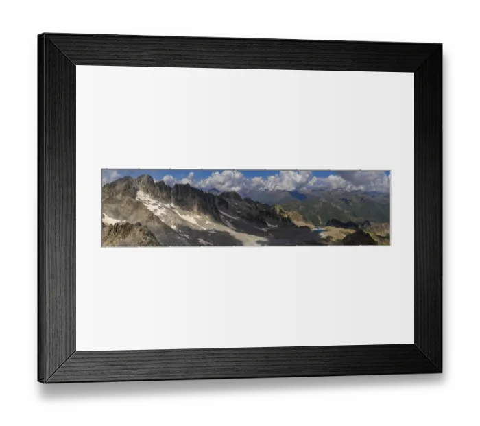 Framed Print : A wide panoramic shot capturing the rugged mountain range with patches of snow and rocky terrain Framed Print : A wide panoramic shot capturing the rugged mountain range with patches of snow and rocky terrain