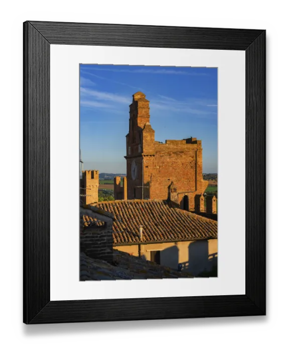 Framed Print : Gradara, Italy - August, 25, 2022: sunset view of clock tower and rooftops in gradara castle