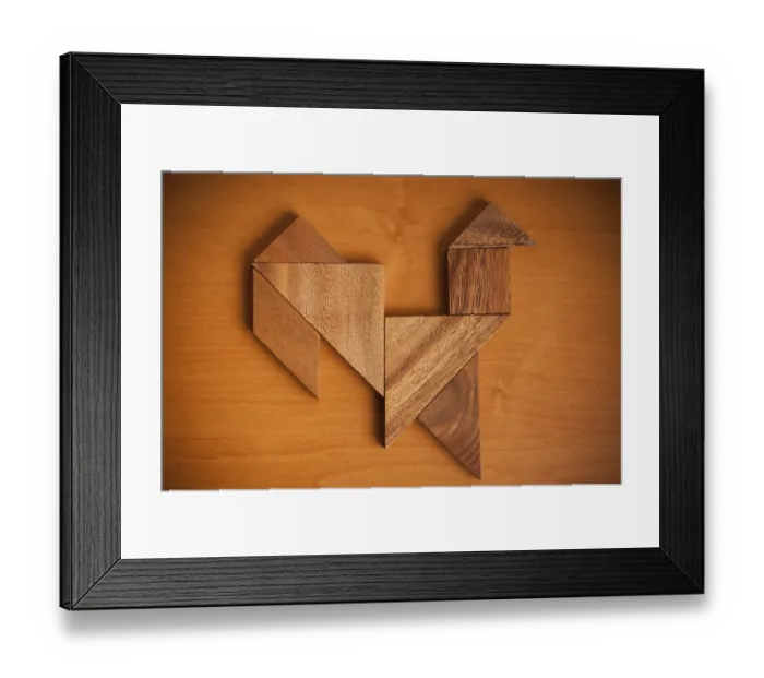 Framed Print : A wooden tangram puzzle arranged into a rooster shape