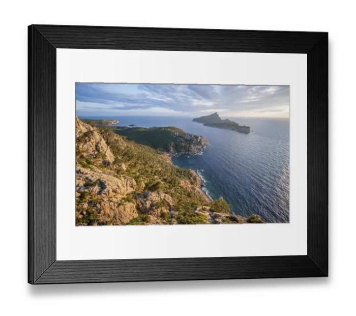Framed Print : Rocky coast with an island, Sunset over the ocean