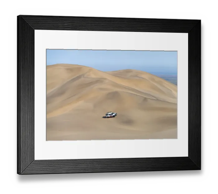 Framed Print : Off-road vehicle in sand dunes above the Orange River