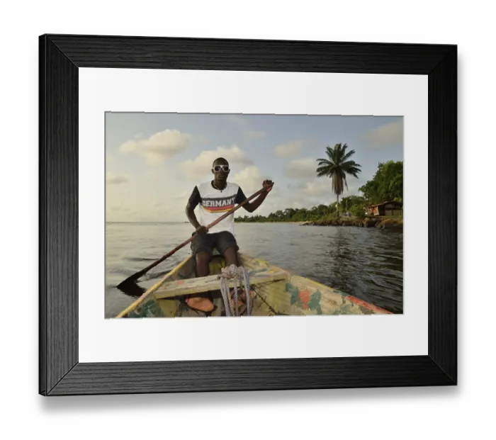 Framed Print : Local man wearing a Germany t-shirt on a boat trip to Lobe Waterfall Framed Print : Local man wearing a Germany t-shirt on a boat trip to Lobe Waterfall