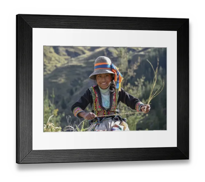 Framed Print : Indio girl with hat smiles and weaves Pacha grass