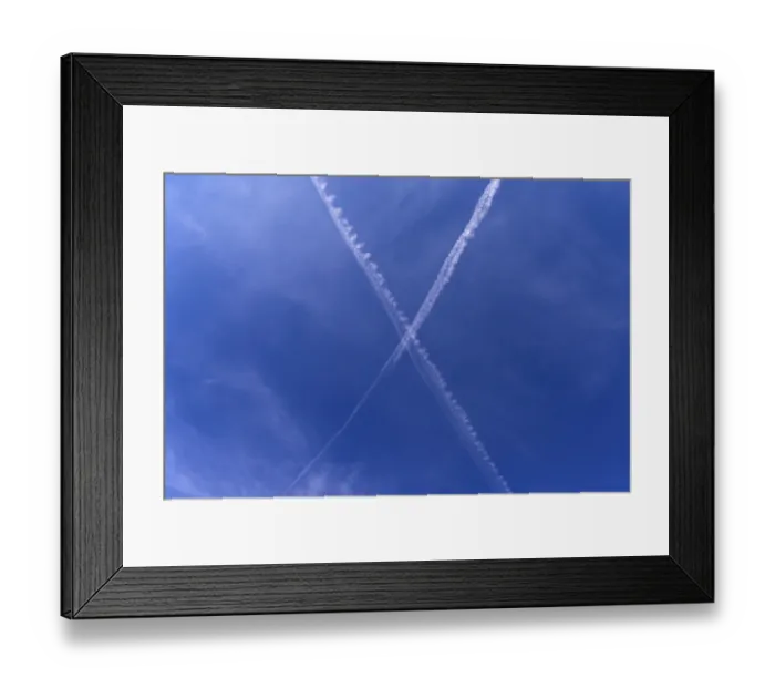 Framed Print : Crossing contrails in the blue sky Framed Print : Crossing contrails in the blue sky