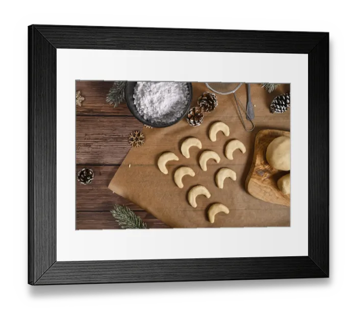 Framed Print : Baking traditional German or Austrian crescent shaped christmas cookies called Vanillekipferl' Baking