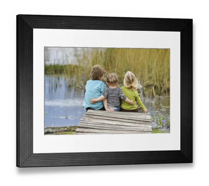 Framed Print : Three toddlers sitting together on an old jetty