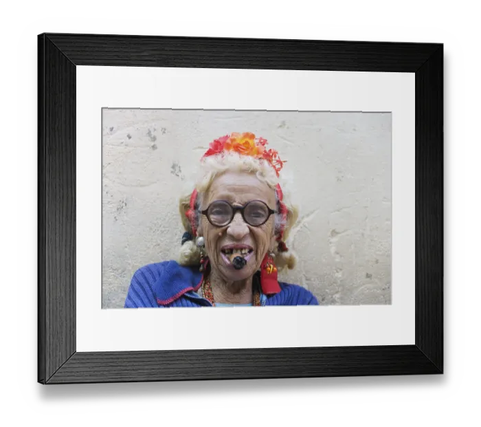 Framed Print : Old woman wearing coulorful clothes posing with a cigar