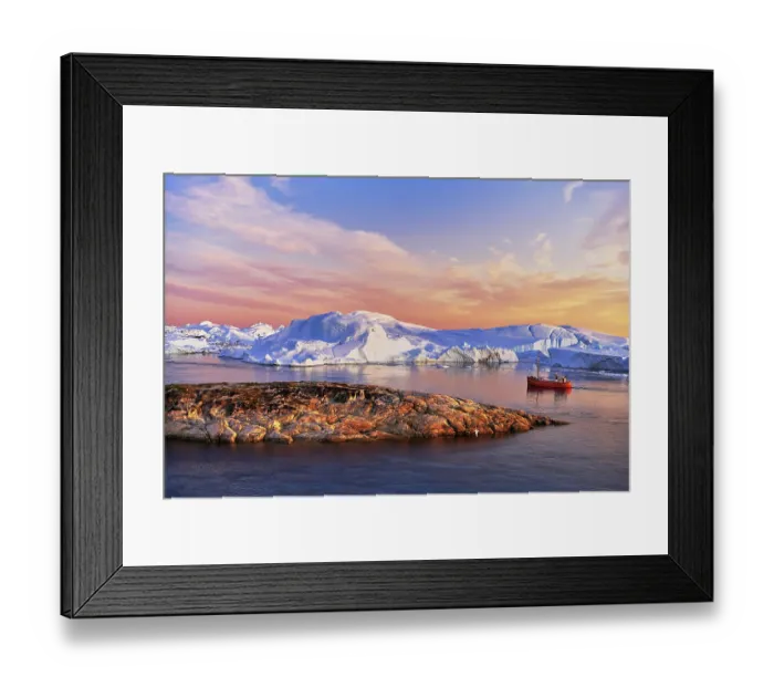 Framed Print : Red boat with tourists in front of icebergs in evening light Framed Print : Red boat with tourists in front of icebergs in evening light