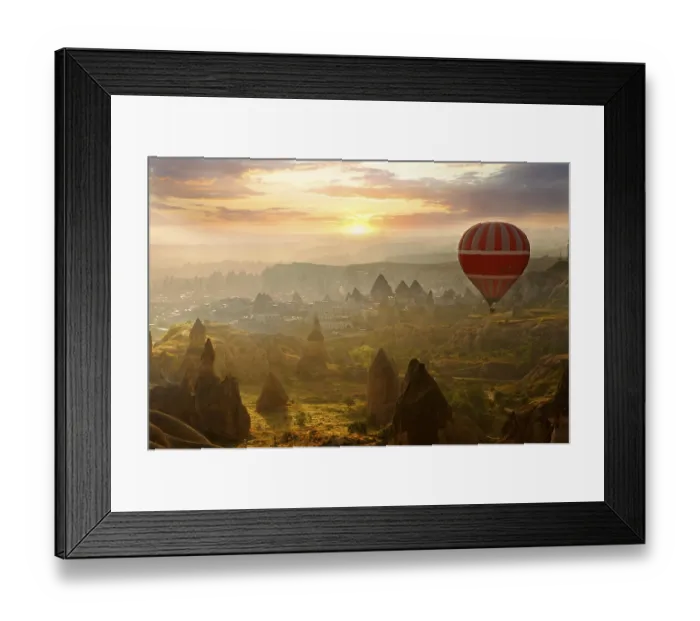Framed Print : Hot air balloon over volcanic tuff rock formations at dawn Framed Print : Hot air balloon over volcanic tuff rock formations at dawn