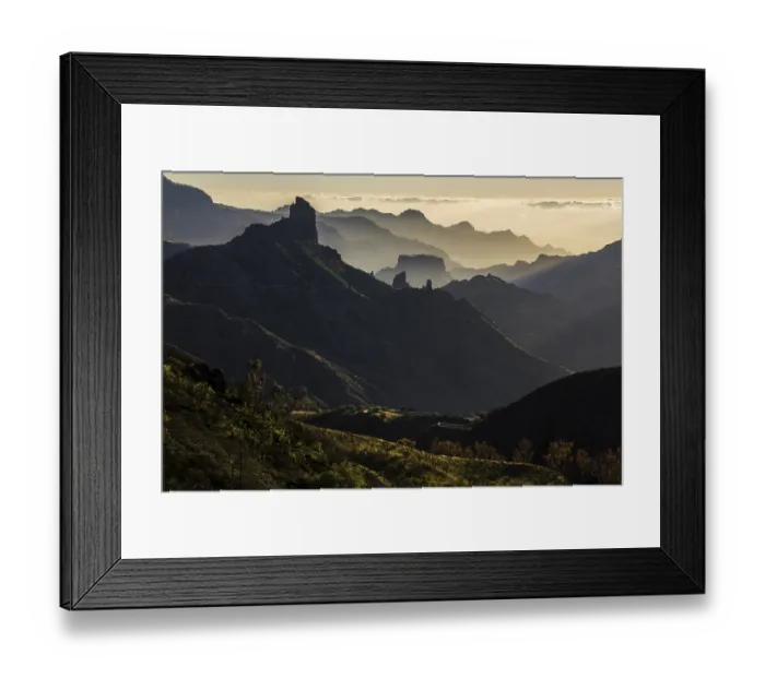 Framed Print : Mountain silhouettes in the back light
