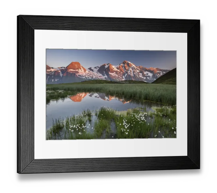 Framed Print : Mountain peaks are reflected in a small pond