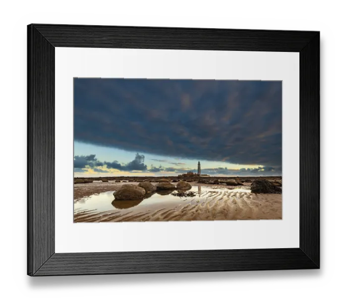 Framed Print : Lighthouse, St. Mary's Lighthouse at low tide with clouds at sunrise