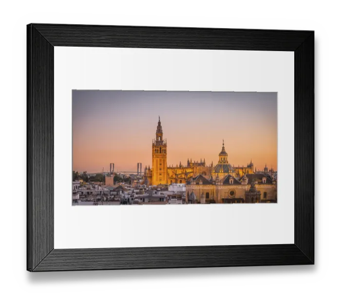 Framed Print : View of La Giralda and Iglesia del Salvador at sunset
