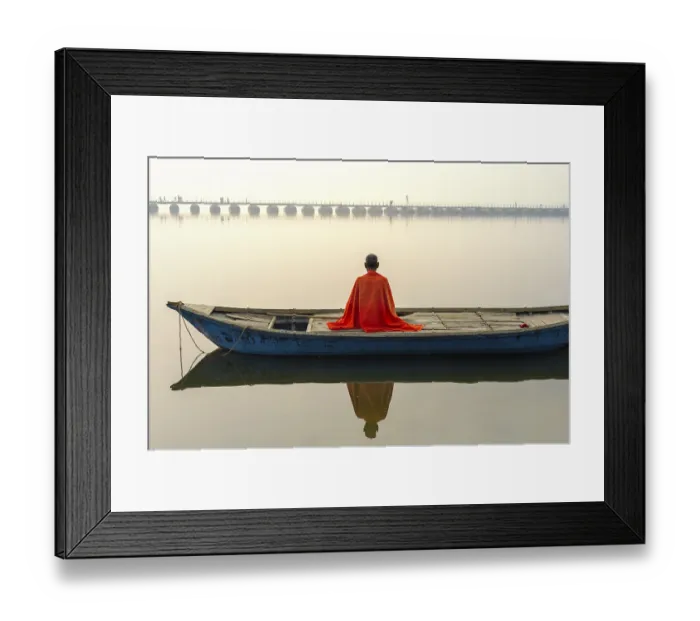 Framed Print : Sadhu with red shawl on a boat on the Ganges river at sunrise Framed Print : Sadhu with red shawl on a boat on the Ganges river at sunrise