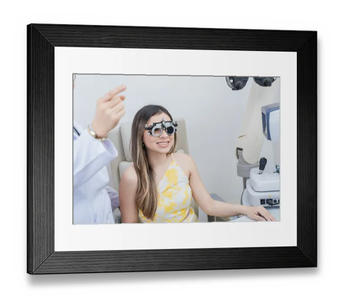 Framed Print : Optometry eye health concept. Optometrist assisting patient with optometrist trial frame