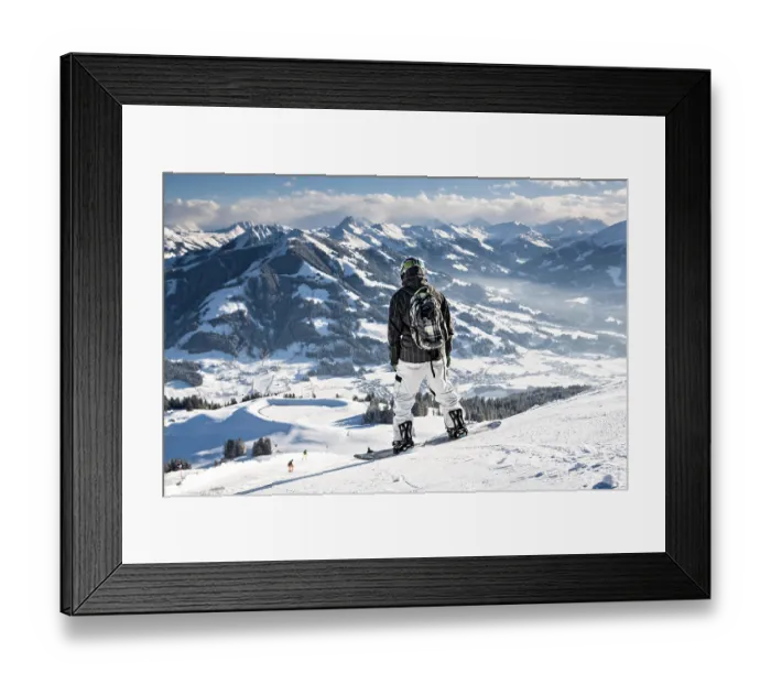 Framed Print : Skier overlooking Wilder Kaiser ski area in the Alps