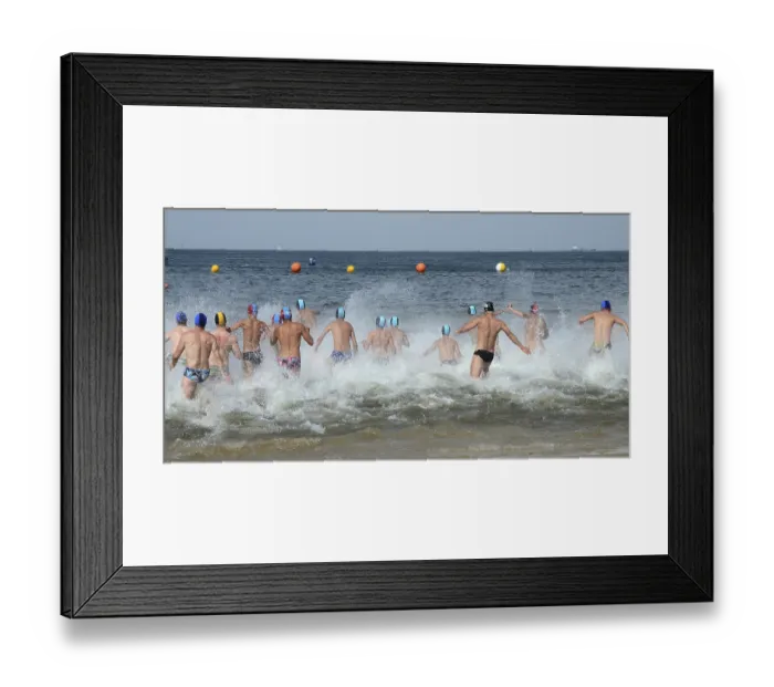 Framed Print : Men running into the sea, Swinoujscie