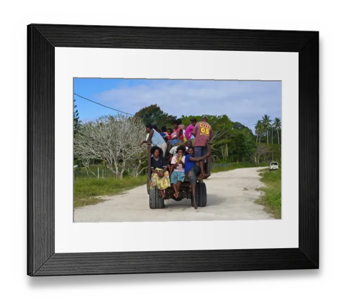 Framed Print : Fully loaded tractor transporting field workers
