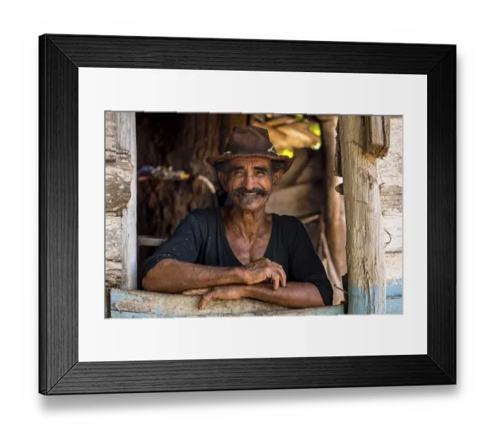 Framed Print : Sugar cane farmer wearing a hat