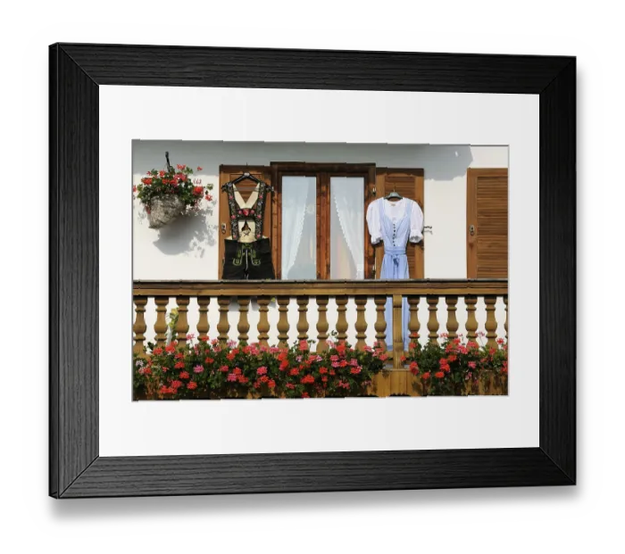 Framed Print : Farmhouse with lederhosen and a dirndl hanging on the shutters Framed Print : Farmhouse with lederhosen and a dirndl hanging on the shutters