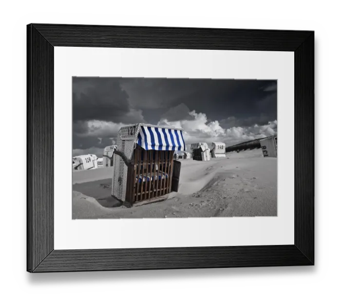Framed Print : Beach chairs, dramatic clouds in the sky