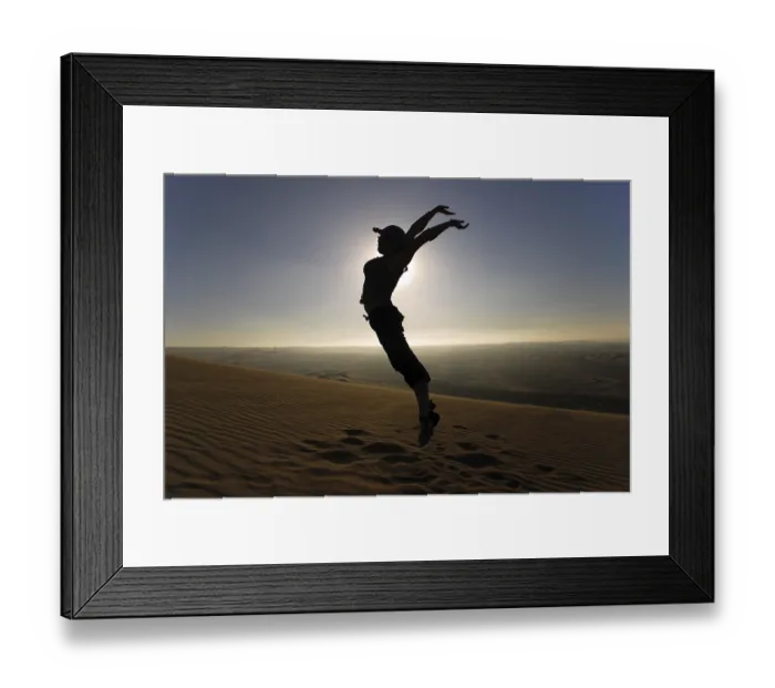 Framed Print : Woman leaping into the air in the desert Framed Print : Woman leaping into the air in the desert