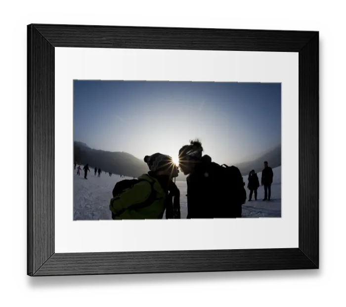 Framed Print : Couple kissing at the ice rink in backlighting Framed Print : Couple kissing at the ice rink in backlighting