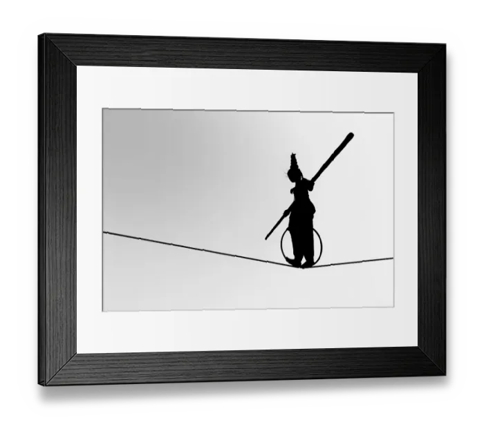Framed Print : Young girl balancing a on rope in silhouette Framed Print : Young girl balancing a on rope in silhouette