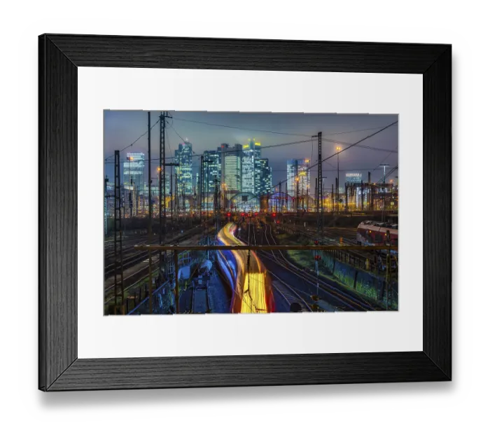 Framed Print : Driving train in front of Frankfurt am Main central station in front of the skyline