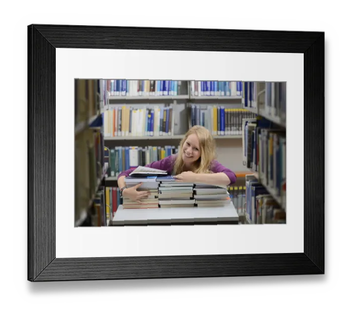 Framed Print : Student studying in the departmental library of the University of Hohenheim in Schloss Hohenheim Palace