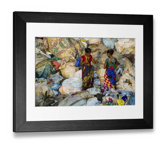 Framed Print : Two women in colorful saris are sorting out garbage for recycling