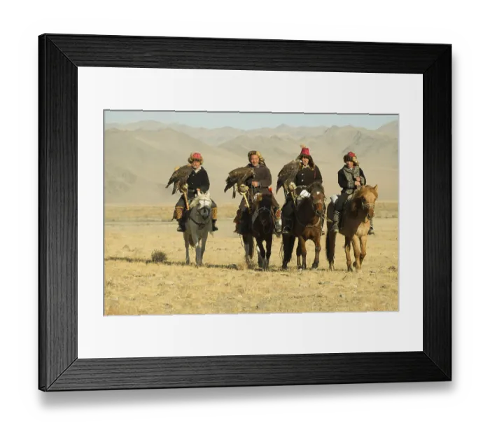 Framed Print : Four Kazakh eagle hunters on their horses on the way to the Eagle Festival in Sagsai
