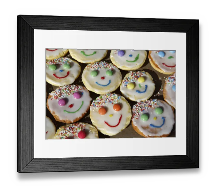 Framed Print : Mini sponge cakes decorated for a child's birthday Mini sponge cakes decorated for a child's birthday