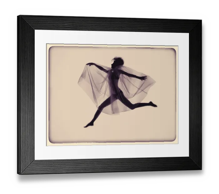 Framed Print : Young jumping woman with wing veil Framed Print : Young jumping woman with wing veil