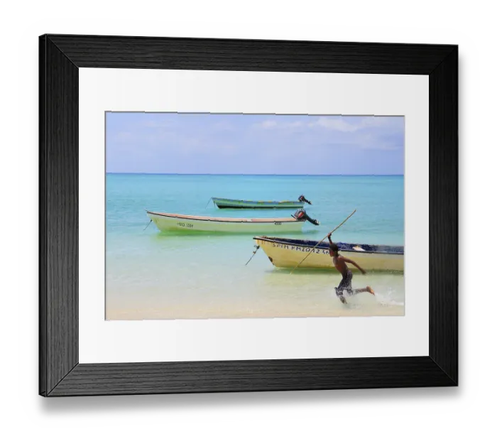 Framed Print : Boy with spear chasing fish in the shallow water Framed Print : Boy with spear chasing fish in the shallow water