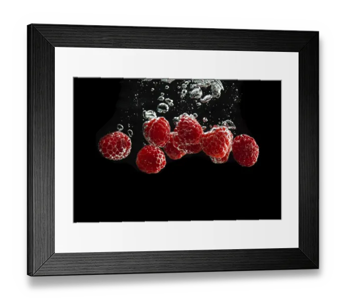 Framed Print : Raspberries fall into water, black background Framed Print : Raspberries fall into water, black background